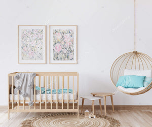 A pastel contemporary floral painting on paper, light and muted in colour palette inspired by peonies.  Shown here hanging in a baby's nursery above the crib. 