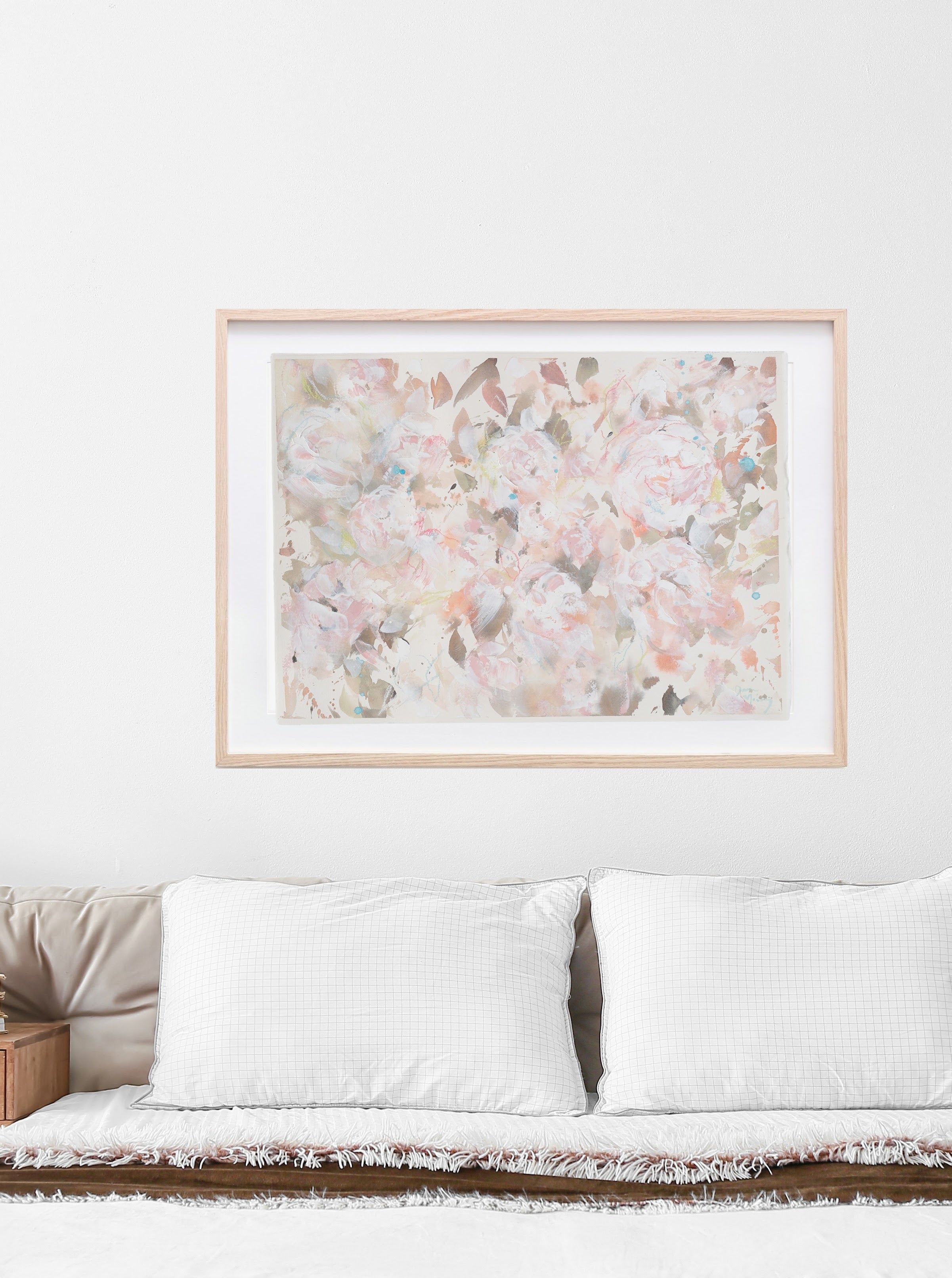 This warm toned mixed media floral painting on paper is soft and welcoming. With a colour palette of terracotta, blush, whites and aqua, this painting is complimentary to your home decor, inviting the viewer to pause and reflect.  Shown here in a bedroom. 