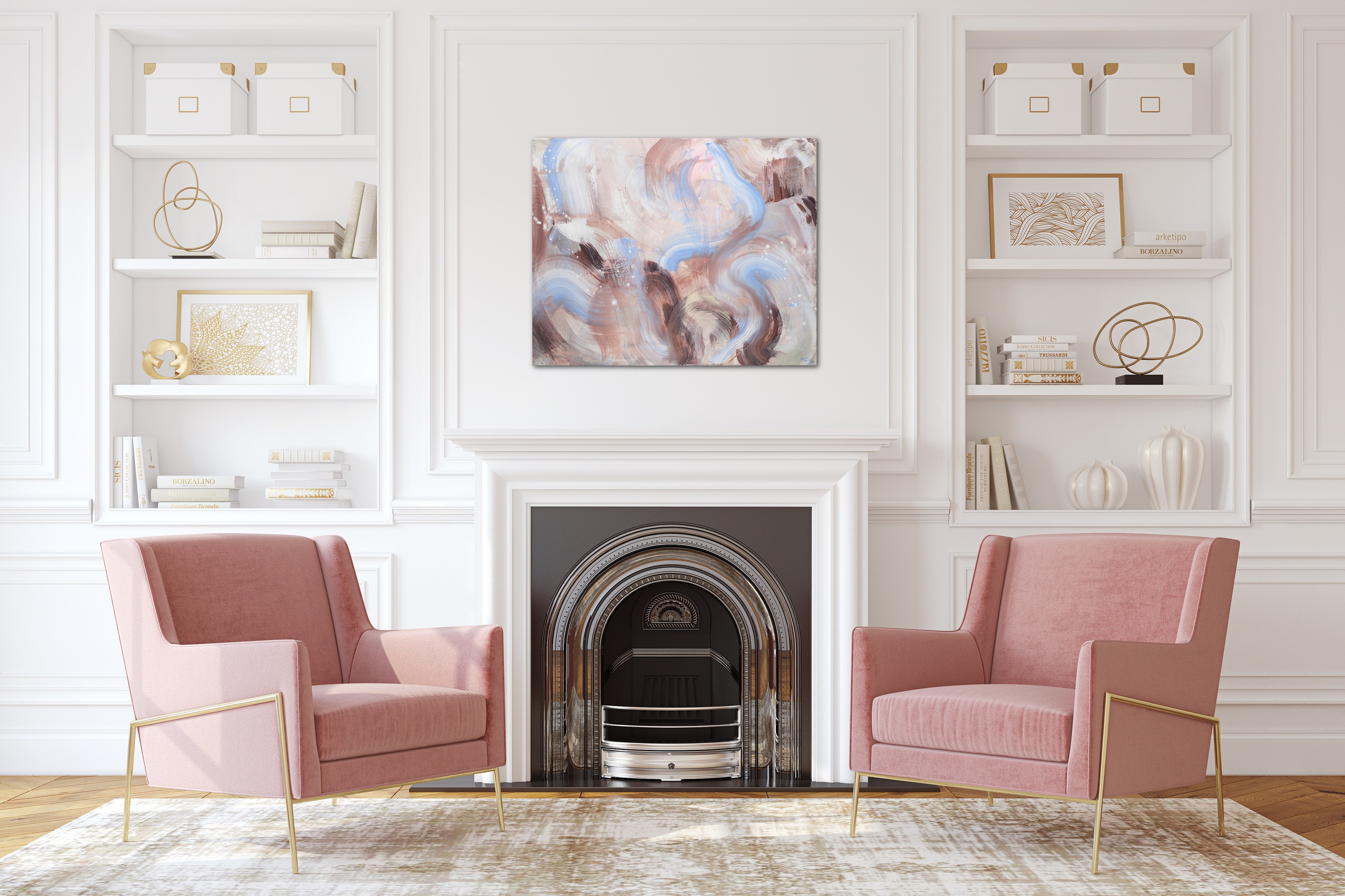 In an airy traditional modern living room, a modern brown, beige and sky blue painting on canvas hangs above the fireplace.  Built in shelves and two pink chairs flank the fireplace. 