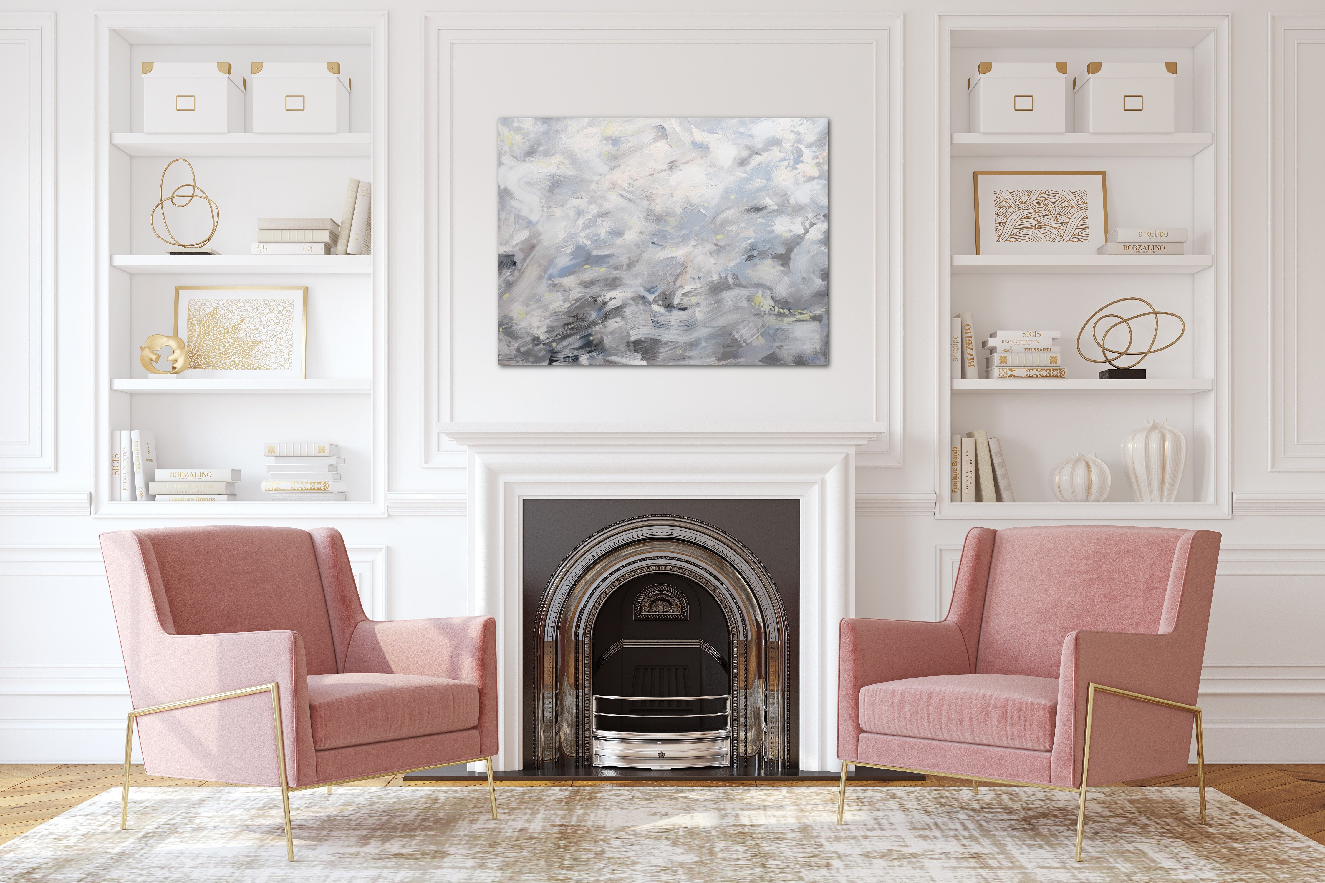 A grey painting hangs above a fireplace in a traditional modern living room.  Two pink chairs add a fun pop of colour to the space. 