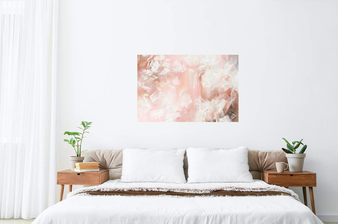A warm toned abstract painting hangs above a minimalist bed in a bedroom.  